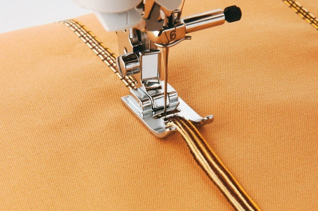 per cordoncino a 7 fori F020N BROTHER - Piedino